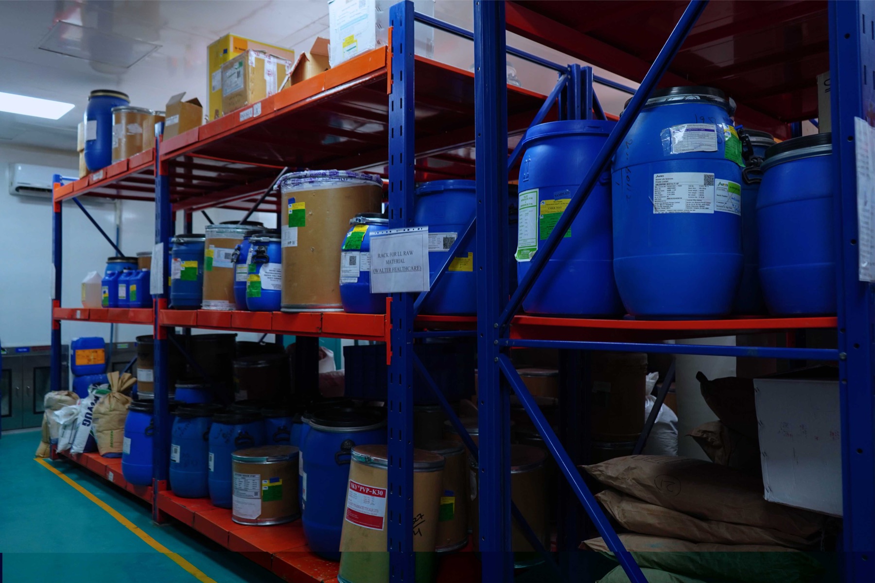 Approved raw-material containers arranged in the in-use and issued storage area